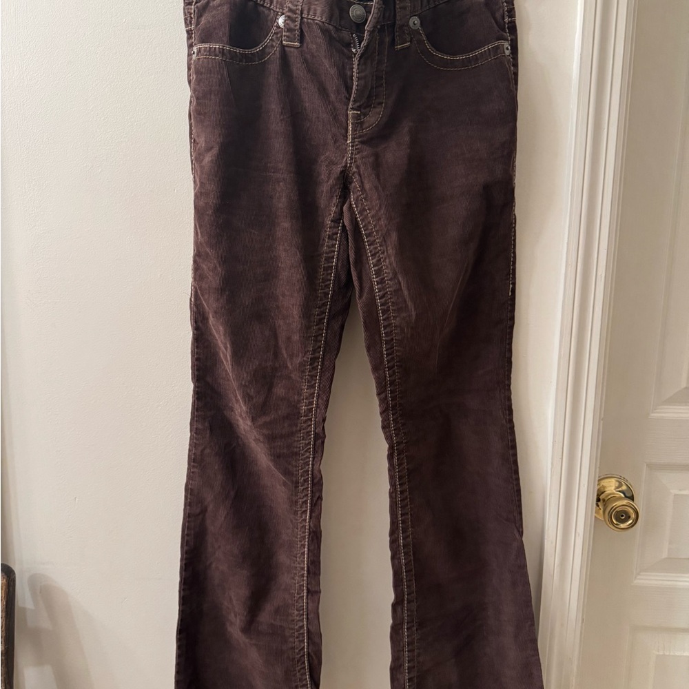 London Jeans brown corduroy boot leg with flap back pockets.